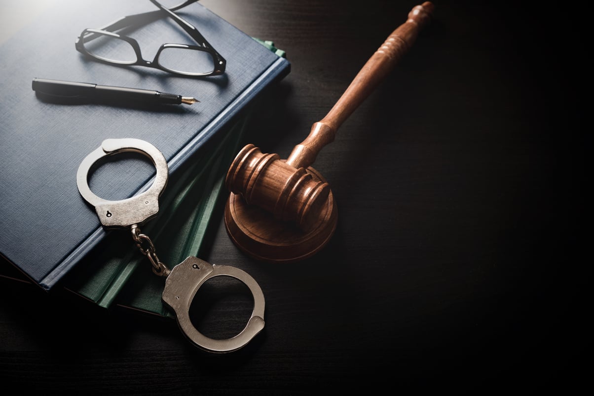 Handcuffs and wooden gavel. Law concept